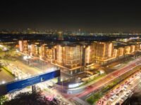 Kawasan komersial Paramount Gading Serpong di malam hari dengan suasana modern dan ramai.