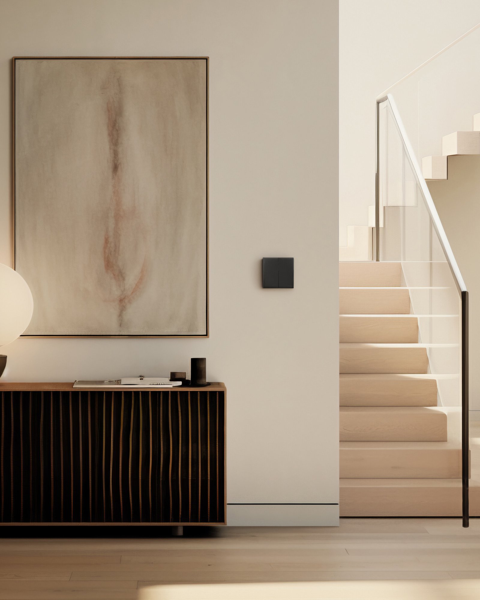 Sakelar Vivace E Schneider Electric warna abu-abu terpasang pada interior rumah modern minimalis dengan konsep clean dan estetis.